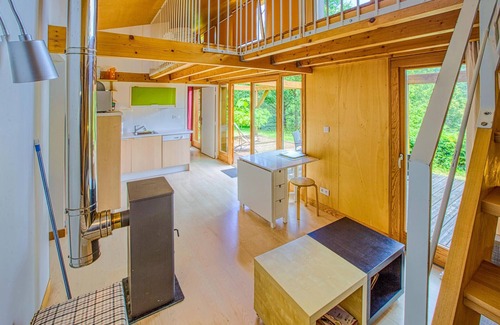 Mirandol-Bourgnounac House | In idyllic location of a forest and near the river Vaur is this cozy wooden house.