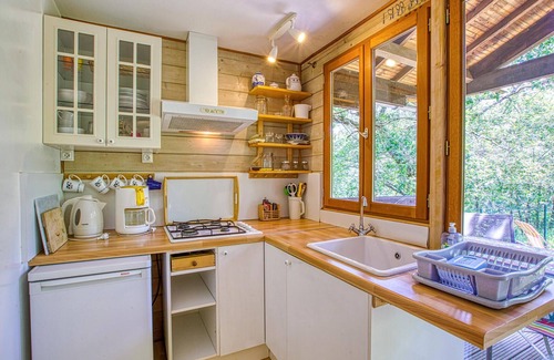 Mirandol-Bourgnounac House | In idyllic location of a forest and near the river Vaur is this cozy wooden house.