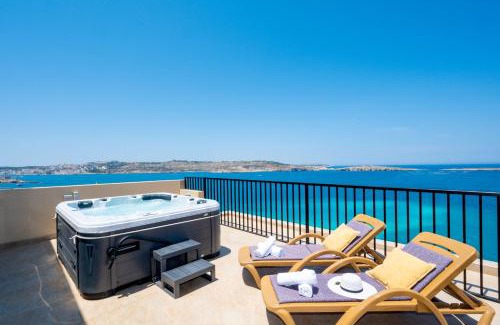 Bugibba Apartment | Islet Promenade Seafront Penthouse with breathtaking seaviews and private hot tub on the large terrace by Getawaysmalta