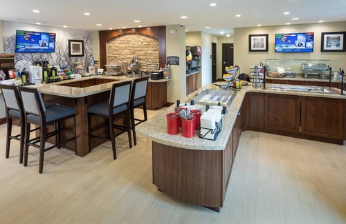 West Omaha Condo | King Suite. Free Breakfast. Pool & Hot Tub. Near the Nebraska Medical Center!