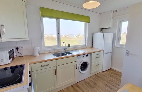 Hayle Cottage | Kingfisher enjoys an elevated position towards the front of the Riviere Towans