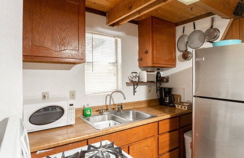 Woodlands Ski Chalet | Knotty Pine Chalet has a huge front deck and fully fenced yard .