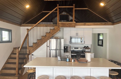 National City Cottage | Lake/beach front property with kayaks, pedal boat, & row boat, near Tawas Bay