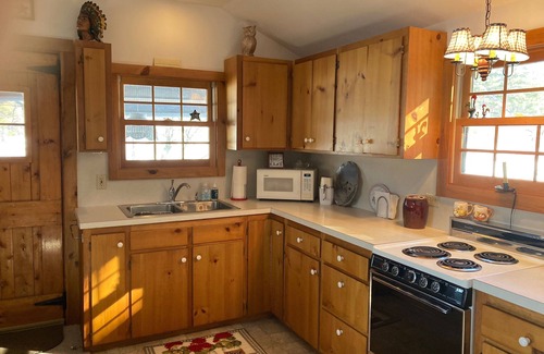 Freedom Cabin | Lake Ossipee New Hampshire waterfront cabin with beach, dock, fire pit, privacy.