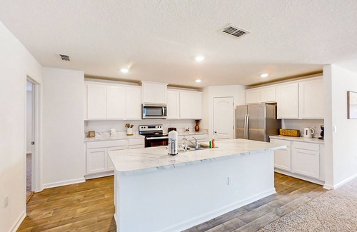 Northside House | Lake-view home with central AC, streaming, washer/dryer, patio, & full kitchen