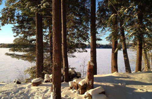 Caroga Lake Cabin | Lakefront accommodations with outdoor Jacuzzi