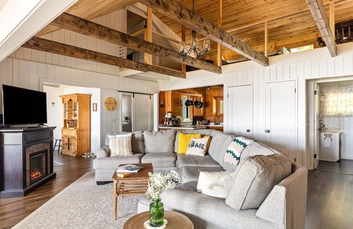 Central Lake Cottage | Lakefront Cottage w/Private Beach, Dock, Kayaks, Fire Pit, Games – Dog Friendly