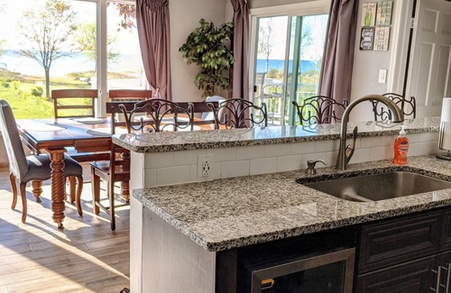 East Tawas House | Lakefront Retreat: Escape to a SANDY Pet Friendly private Lake Huron Beach!