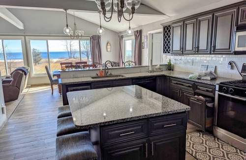 East Tawas House | Lakefront Retreat: Escape to a SANDY Pet Friendly private Lake Huron Beach!