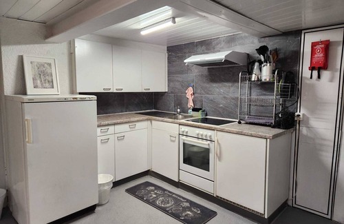 Schwanden Apartment | Large studio in Schwanden with mountains and river. 5 minutes to train station.