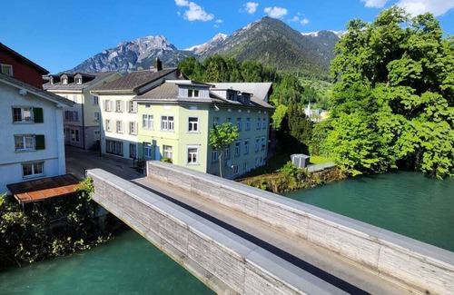Schwanden Apartment | Large studio in Schwanden with mountains and river. 5 minutes to train station.