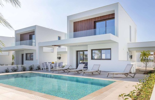 Softades House | Larnaca Blue 16 is a contemporary villa on a gated complex.