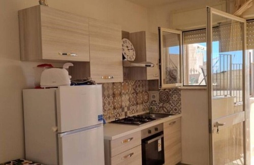 Specchiarica Apartment | le Case di Pat: Palm home, 200mt from the beach and turquoise sea