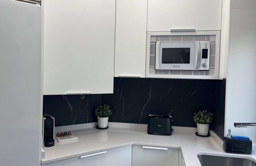 Castro Urdiales Apartment | Loft apartment "Black and White Suite Castro" with Jacuzzi and fireplace.