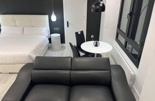 Castro Urdiales Apartment | Loft apartment "Black and White Suite Castro" with Jacuzzi and fireplace.