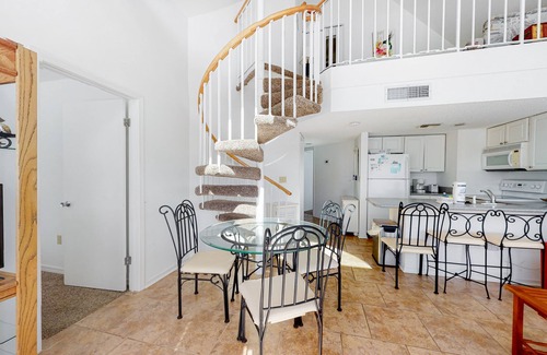 Fort Morgan Condo | Loft-like condo with balcony, easy beach access, pools, hot tubs & tennis