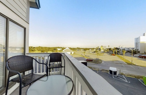 Fort Morgan Condo | Loft-like condo with balcony, easy beach access, pools, hot tubs & tennis