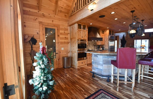 Commiskey House | Log cabin on 108 private acres - cozy inside, adventure outside!