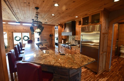 Commiskey House | Log cabin on 108 private acres - cozy inside, adventure outside!