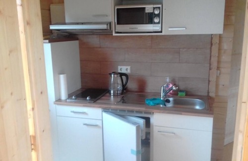 Schonwalde House | Log cabin with its own lake