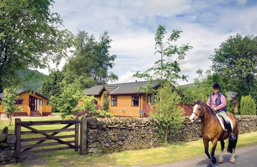 Selkirk Ski Chalet | Log cabin with one double with en suite shower and two twin.