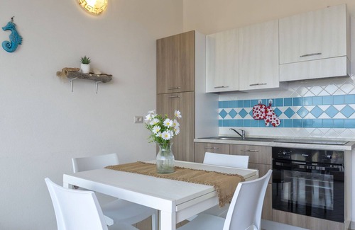 Paduledda Apartment | Lovely apartment for 4 guests with A/C, pool, TV, terrace and pets allowed