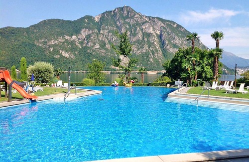 Bissone Apartment | Lovely apartment for 4 people with A/C, WIFI, pool, TV, balcony, panoramic view and parking