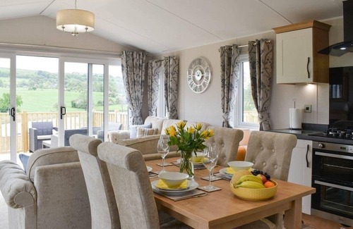 Fence Cabin | Luxury 2 bedroom, pet-friendly lodge on the side of a beautiful fishing lake.