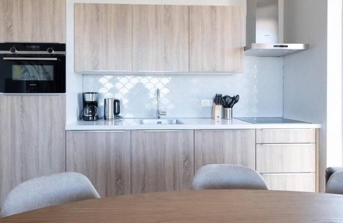 Workum Apartment | Luxury 4-person apartment with sauna, bathtub, and balcony overlooking the IJsselmeer. Ideal for a relaxing stay by the water.