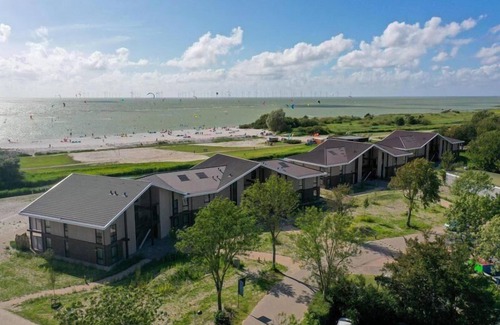 Workum Apartment | Luxury 4-person apartment with sauna, bathtub, and balcony overlooking the IJsselmeer. Ideal for a relaxing stay by the water.
