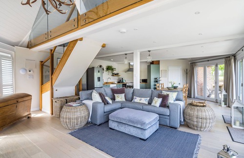 Barns Green House | Luxury Boathouse situated on a private lake, with panoramic views and a hot tub.