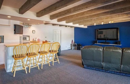 Milton House | Luxury Lakehouse with Large Private Beach, Hottub, Tiki Bar, 100’ Covered Deck, and Dock