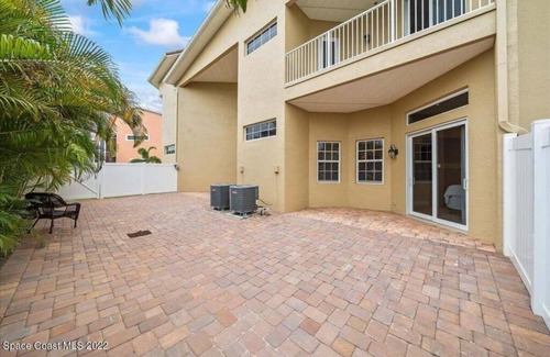 Indian Harbour Beach House | Luxury Mediterranean villa with courtyard by the beach where you eat, play love.