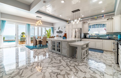 San Pedro House | Luxury Oasis: Serene Beachfront with Pool & Dock