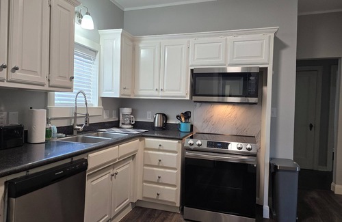 Denison House | Magnolia Manor Duplex in Downtown Denison-Bursting with Charm & Comfort