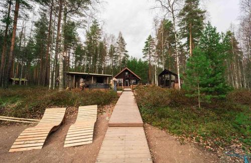 Loppi Ski Chalet | Minivilla Peikonpesä ulkoporeallas & pihasauna