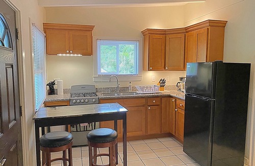 Cane Bay Cottage | Minutes Walk to Cane Bay Beach- Porch Mountain Views, Sea from the backyard