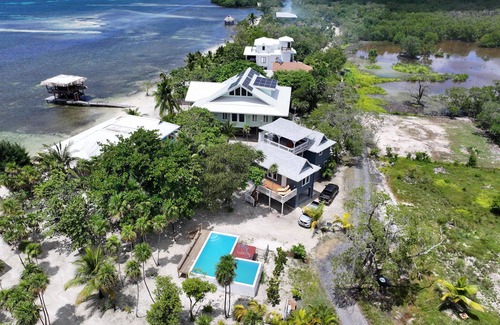 Roatan House | Modern 2 Bedroom Beachfront Home - Steps from the Sea w/Patio, Shared Pool&Dock