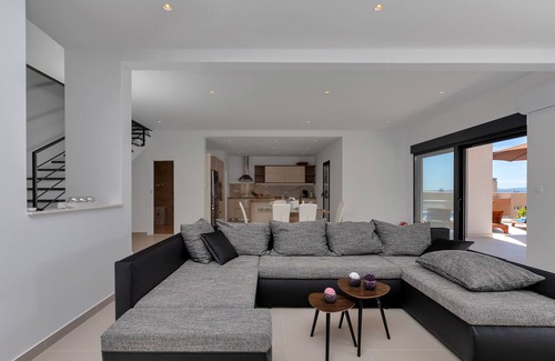 Bast House | Modern holiday home with infinity pool, three bedrooms, terrace, sea view