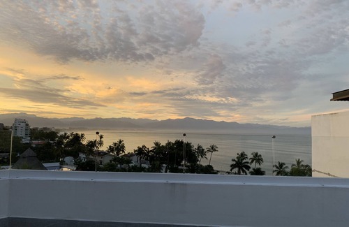 Bucerias Apartment | Modern penthouse with private terrace -18 unit bldg- 1/2 block from the beach.