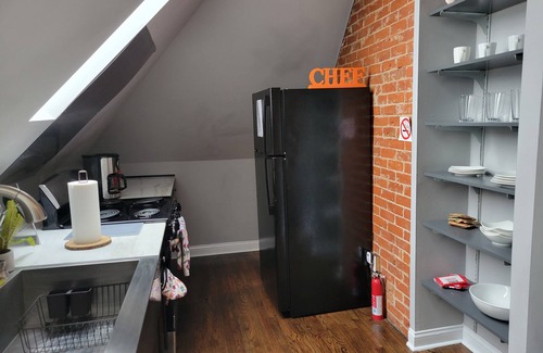 Corryville Apartment | Modern rustic split-level with private balcony