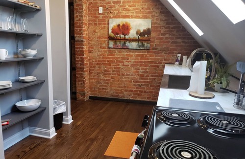 Corryville Apartment | Modern rustic split-level with private balcony