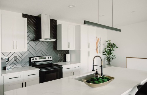 Des Moines House | Modern Townhome with Skyline Views, Heated Balcony & Curated Art in Downtown DSM