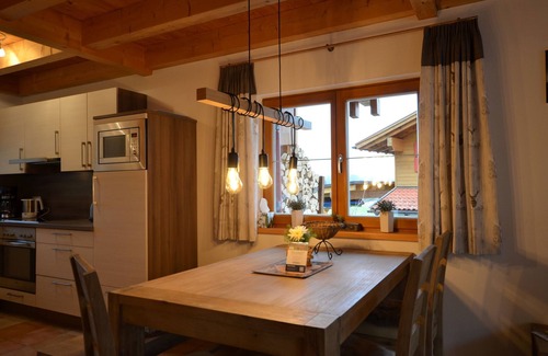 Lechbruck House | Modern vacation home by the lake in the Via Claudia vacation village with balcony and fireplace