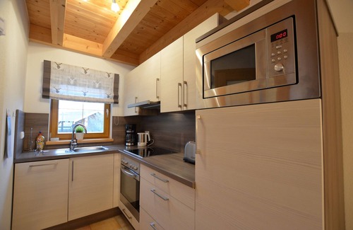 Lechbruck House | Modern vacation home by the lake in the Via Claudia vacation village with balcony and fireplace