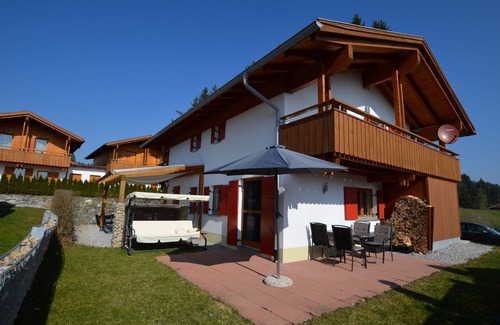 Lechbruck House | Modern vacation home by the lake in the Via Claudia vacation village with balcony and fireplace