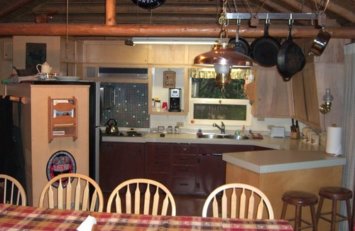 Proctor House | Moose Lodge Rustic Log Home Includes Two Boat Slip Dock with 2 guest cabins