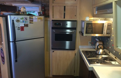 Proctor House | Moose Lodge Rustic Log Home Includes Two Boat Slip Dock with 2 guest cabins