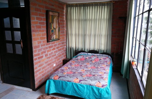 Banos de Agua Santa Bed & Breakfast | MYSTIC LODGE. Unique View.Unique Place.Unique Experience