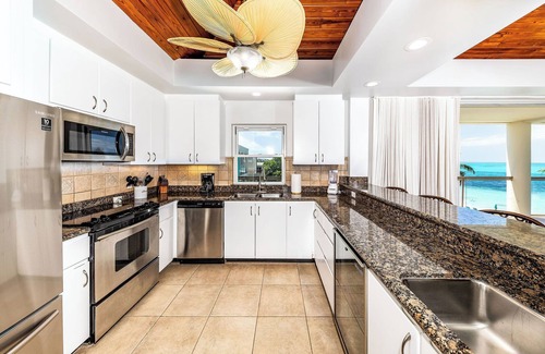 The Bight Condo | NEW LISTING: Pristine 2-Bedroom Oceanfront Penthouse Suite on Grace Bay Beach